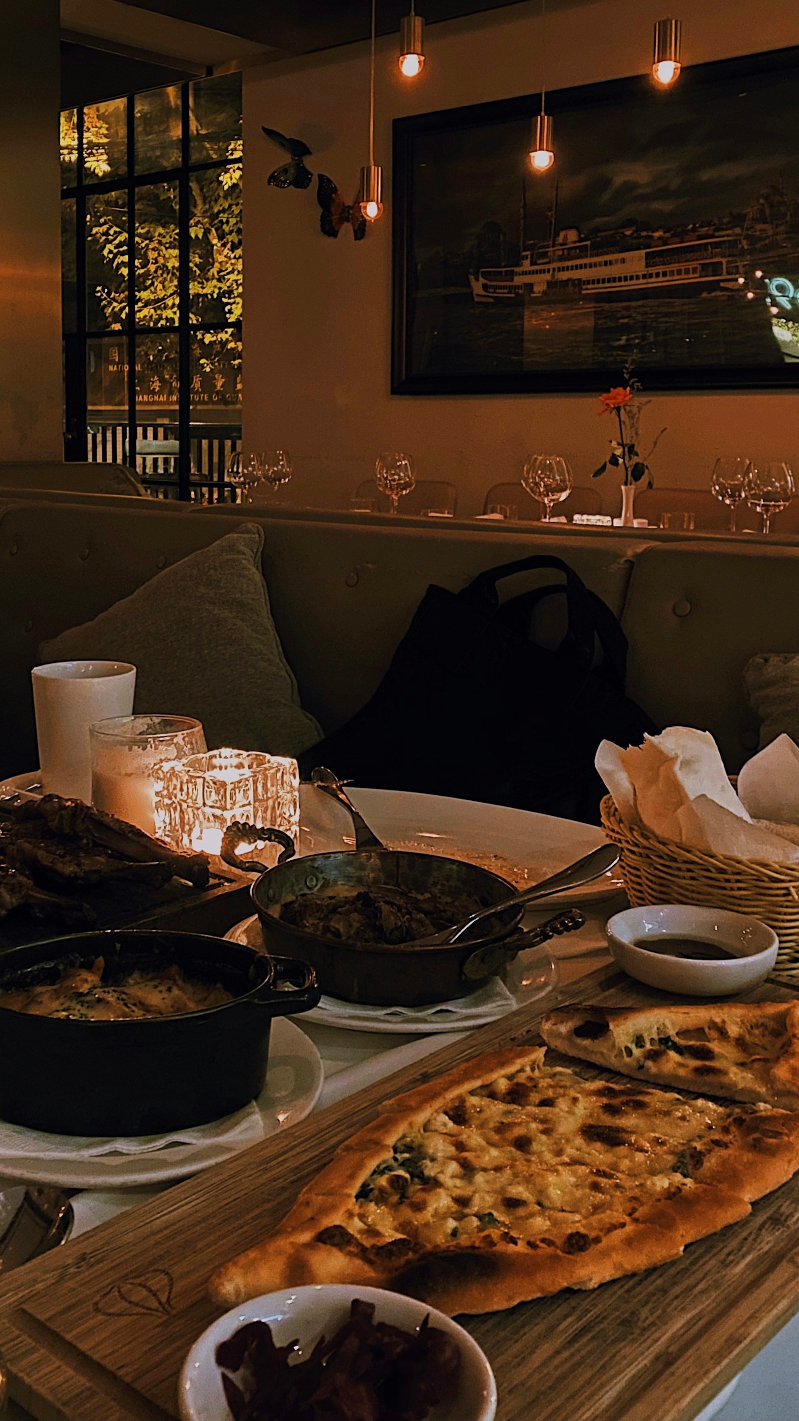 A cozy candlelit dinner setup on a wooden patio.